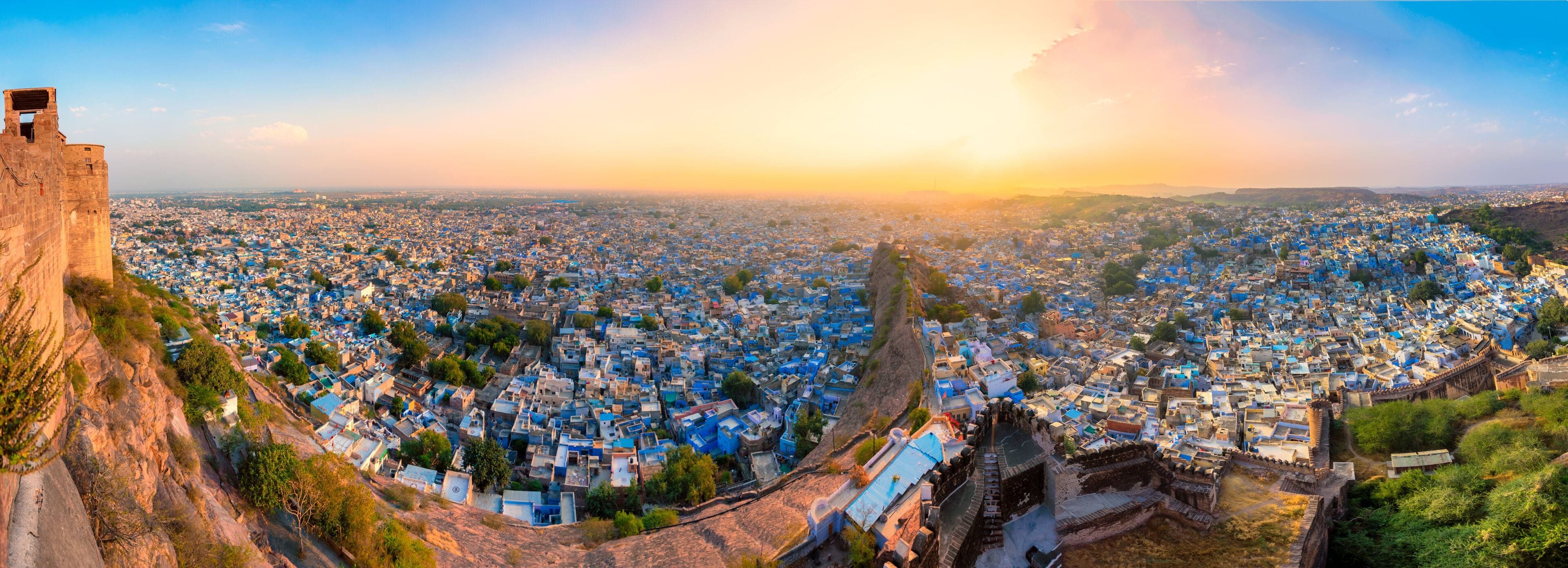 Blue painted houses of Jodhpur old city with Mehrangarh Fort above