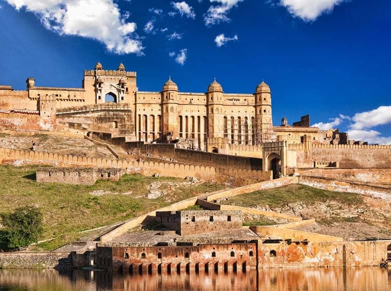 Amber Fort Jaipur with its majestic walls reflected in the lake